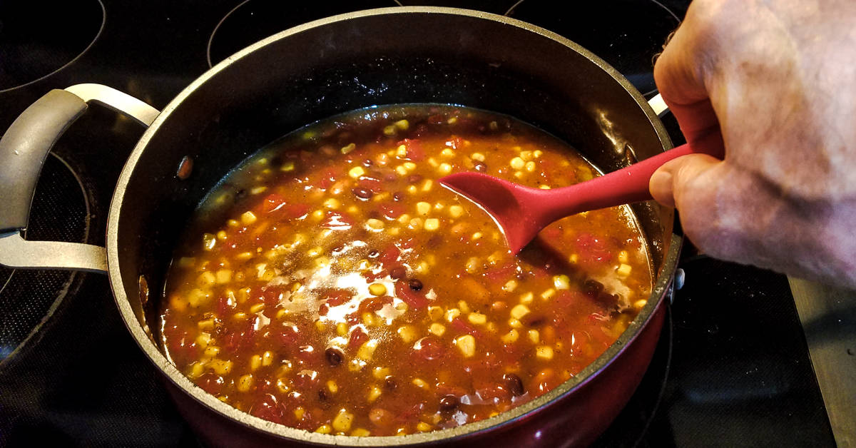 shrimp taco soup mixing the ingredients