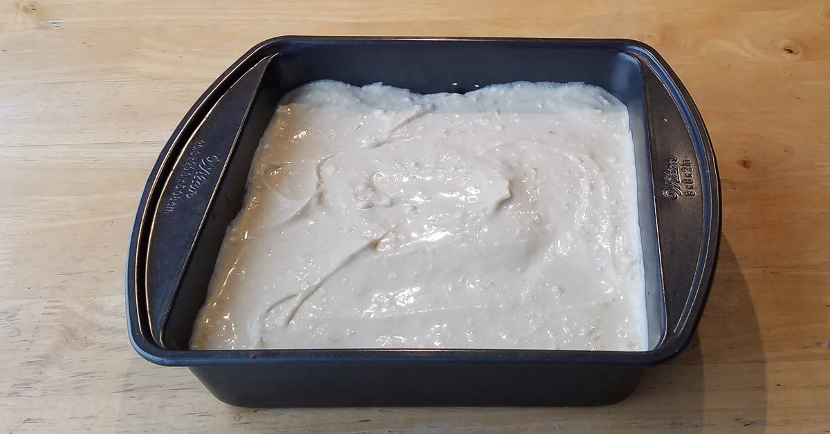 Cream Cheese Brownies filling spread over batter