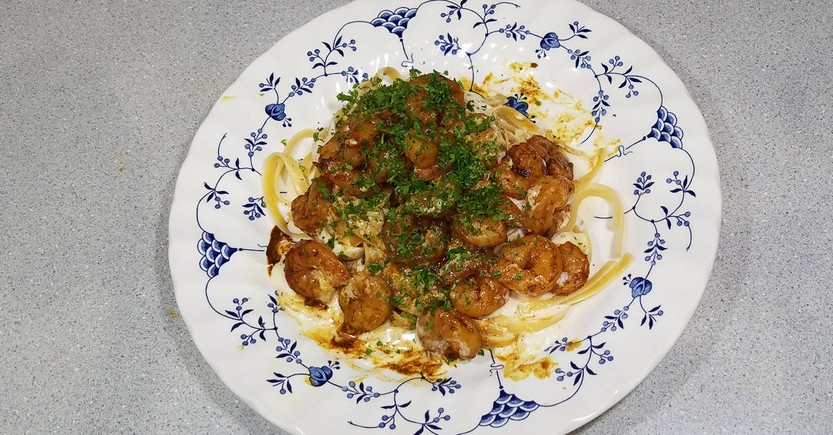 Moroccan Spiced Shrimp Fettuccine topped with shrimp and parsley