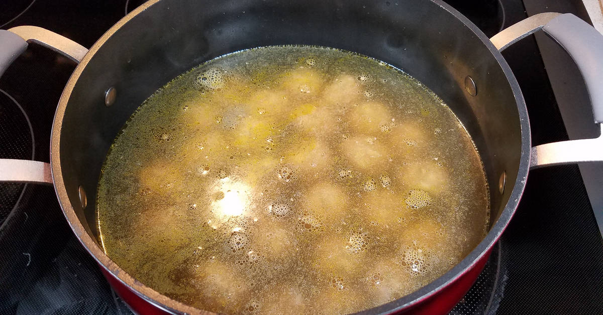 Greek Lemon Soup meatballs in the pot