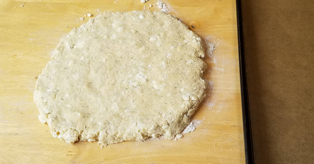 Savory Greek Flavored Scones dough flattened into a circle