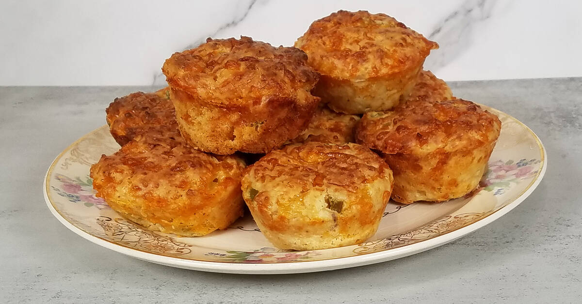 Cheese and Jalapeno Muffins stacked on a plate