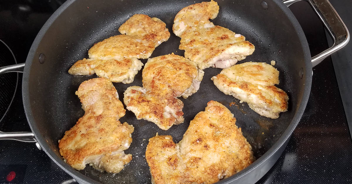 Creamy Garlic Bacon Chicken flipped over in the pan