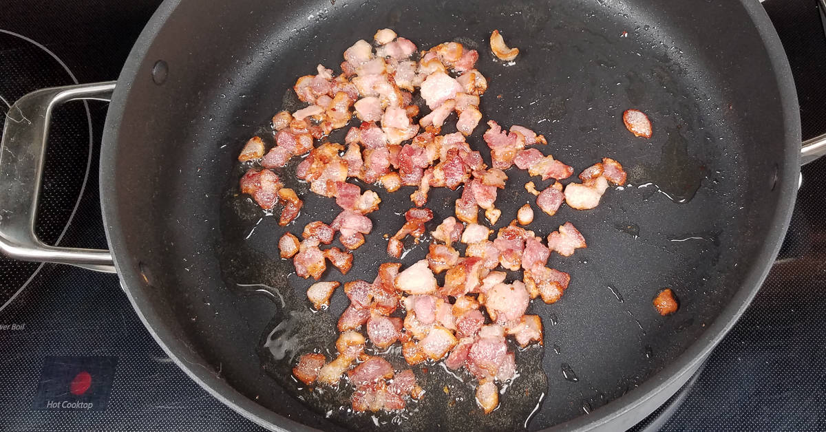 Creamy Garlic Bacon Chicken sauteing the bacon
