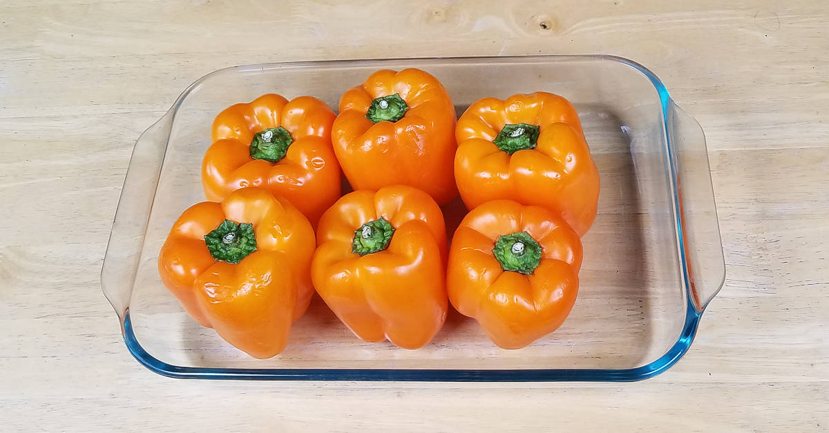 How to Prep Peppers six peppers upright in a 9x13 pan