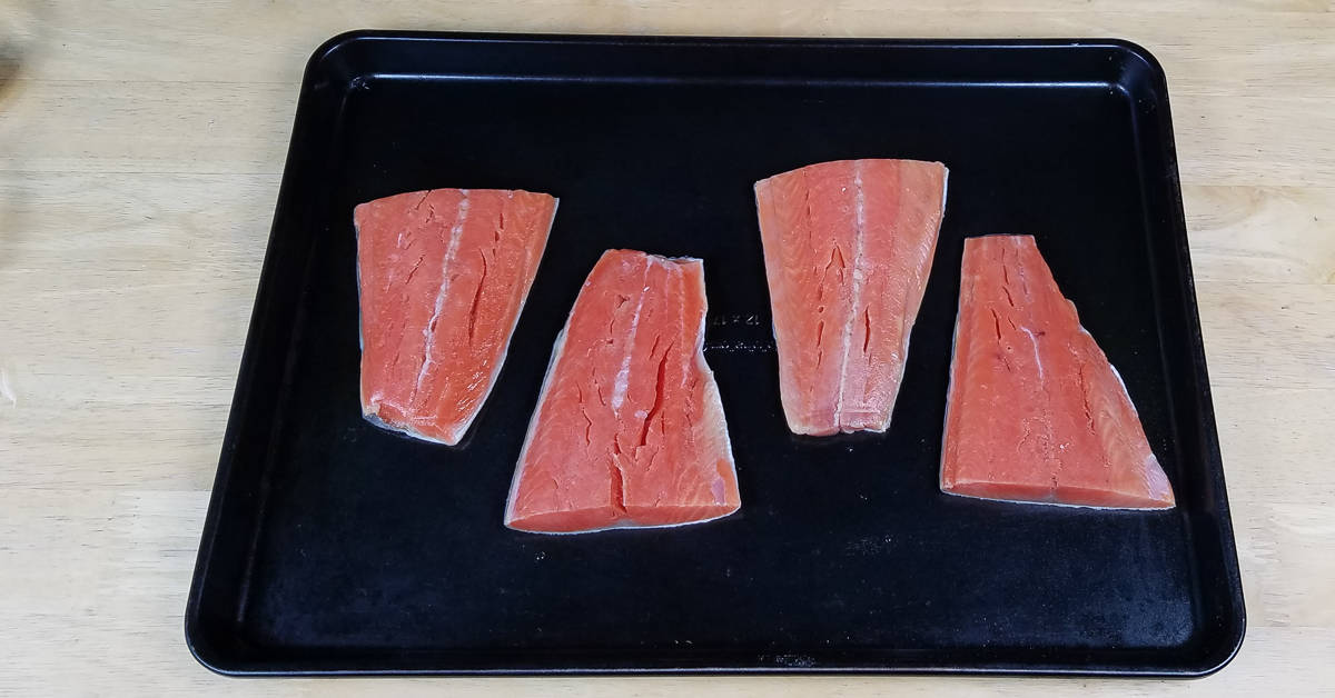 Salmon with Pistachio and Horseradish Crust fillets on a baking pan