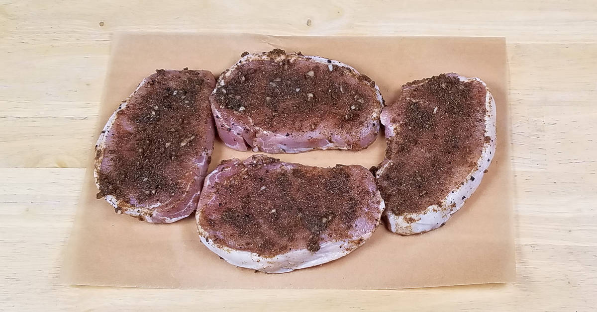Spice Rubbed Pork Chops coated with spice mixture