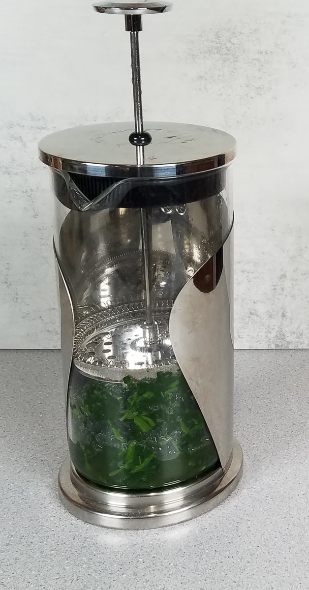 Straining Spinach put the plunger in