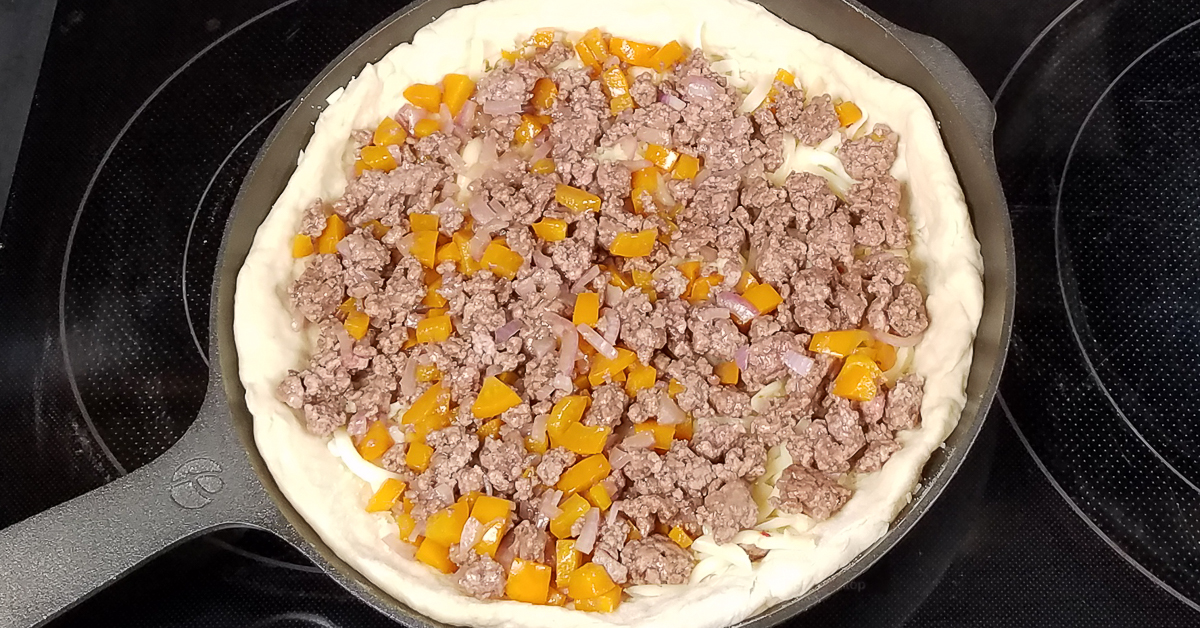 Chicago Style Stuffed Pizza meat and peppers added to pizza