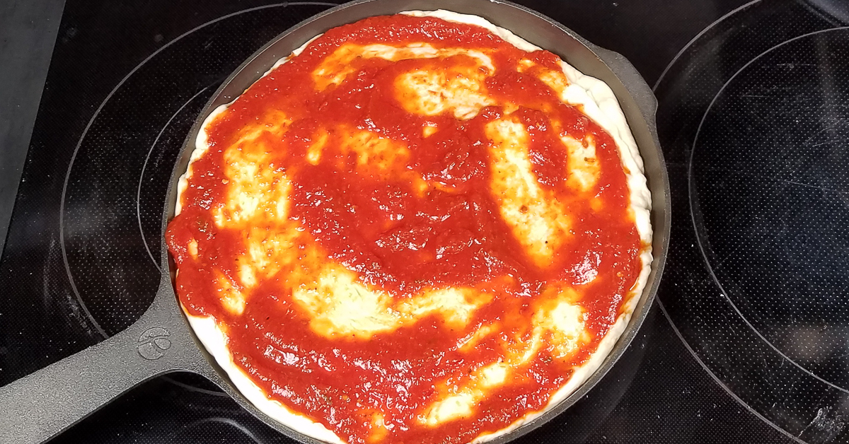 Chicago Style Stuffed Pizzatop crust and sauce added to pizza