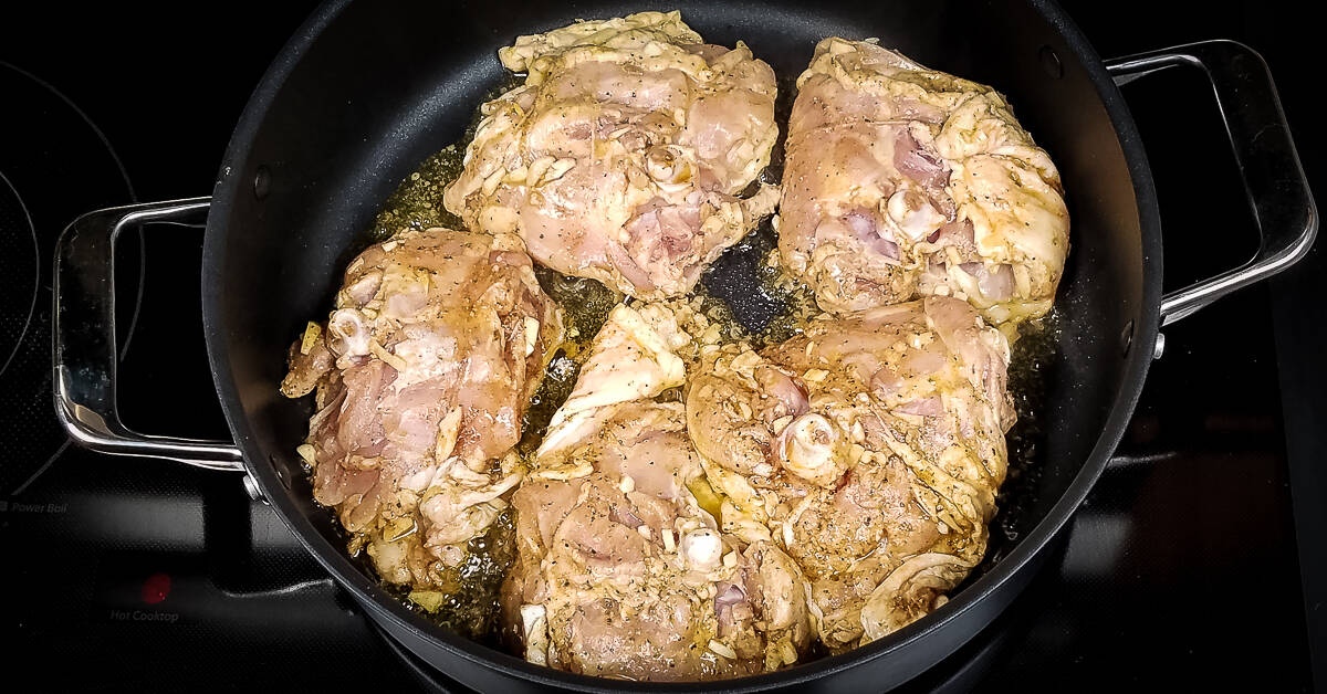 Middle Eastern Chicken and Rice chicken cooking skin side down
