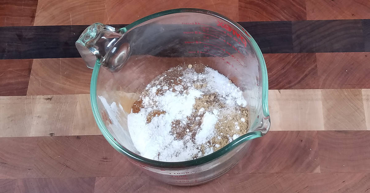 Raspberry Custard Kuchen sugar flour and spices in a arge measuring cup