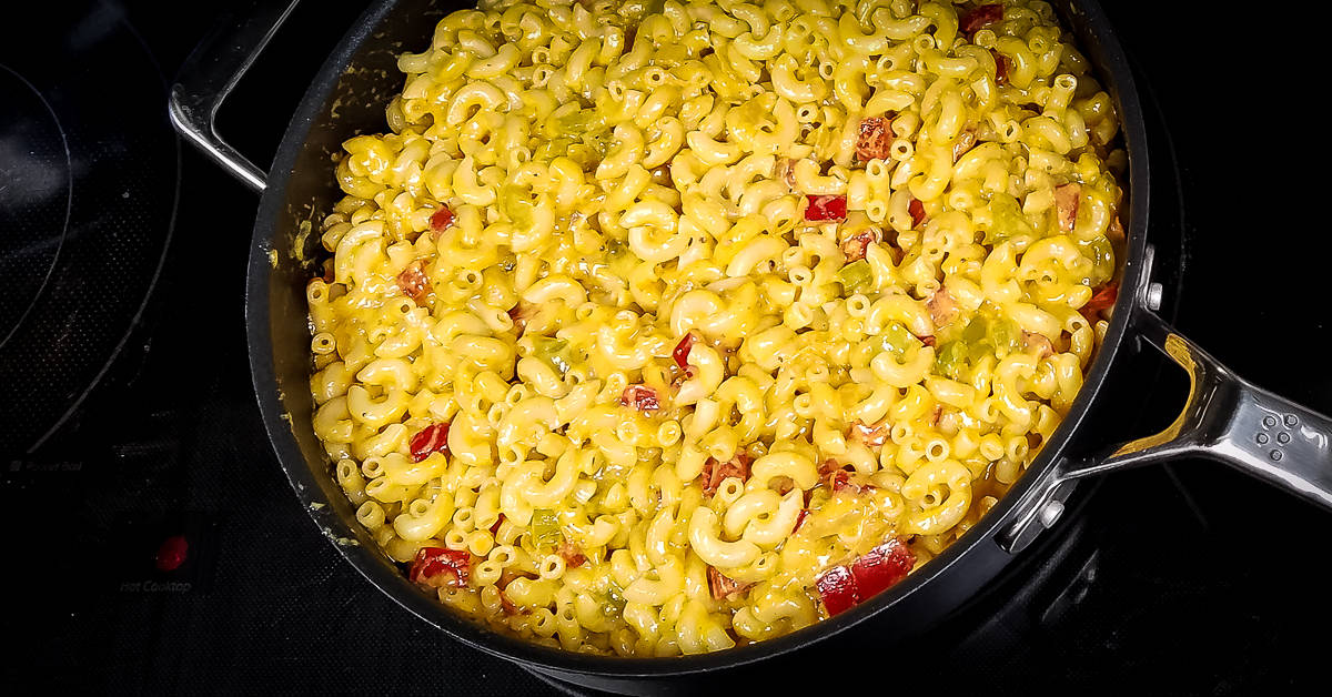 Spicy Mac and Cheese macaroni mixed into pan