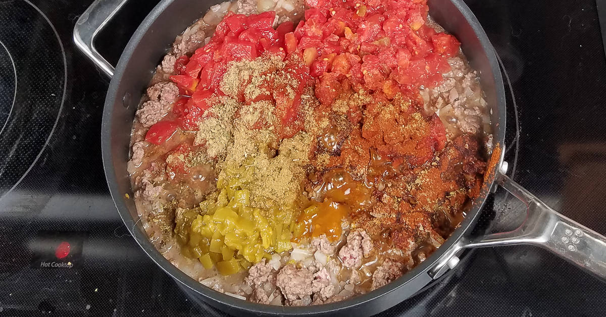 Tex Mex Casserole adding tomatoes and spices