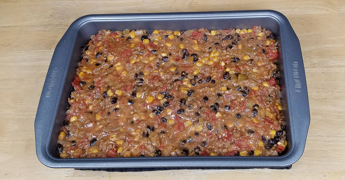 Tex Mex Casserole poured into 9x13 baking pan