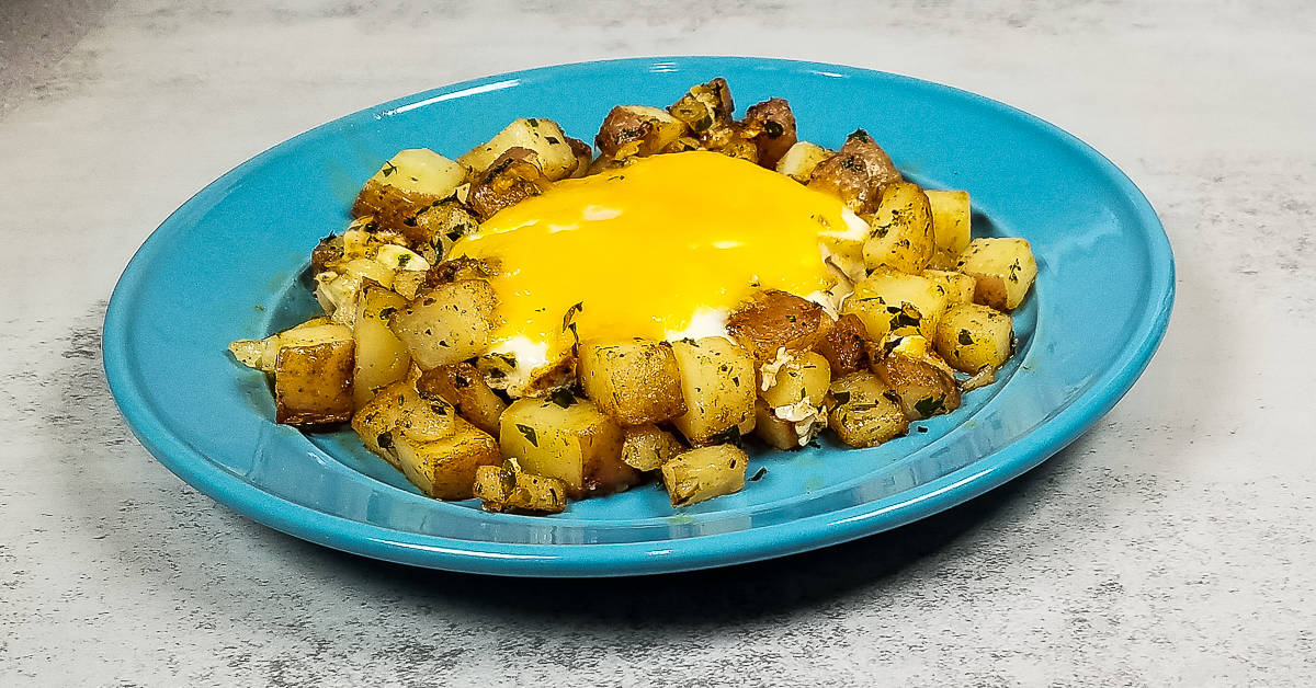 Pan Fried Potatoes and Eggs on a plate