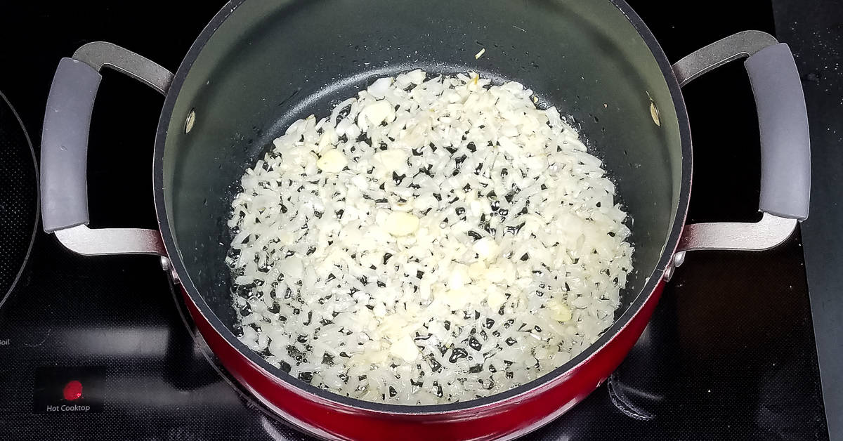 Creamy Zucchini Soup sauteing garlic