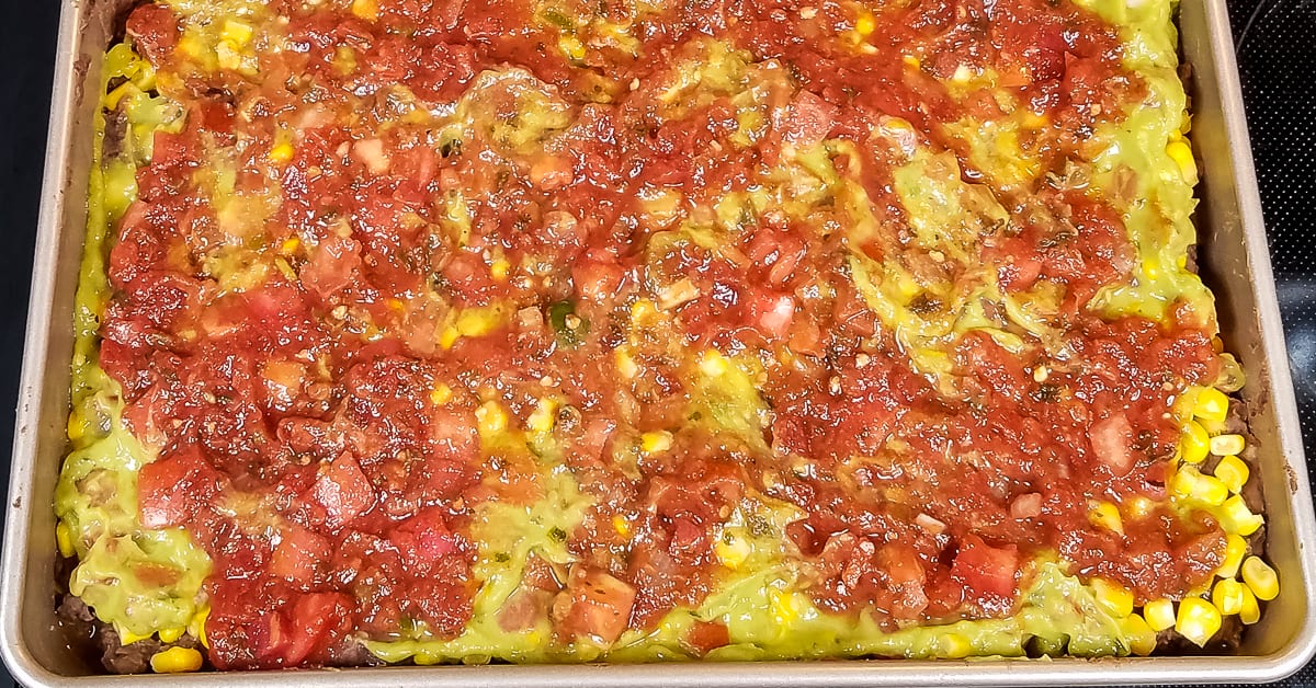 Layered Tex Mex Casserole layer of salsa added to baking pan