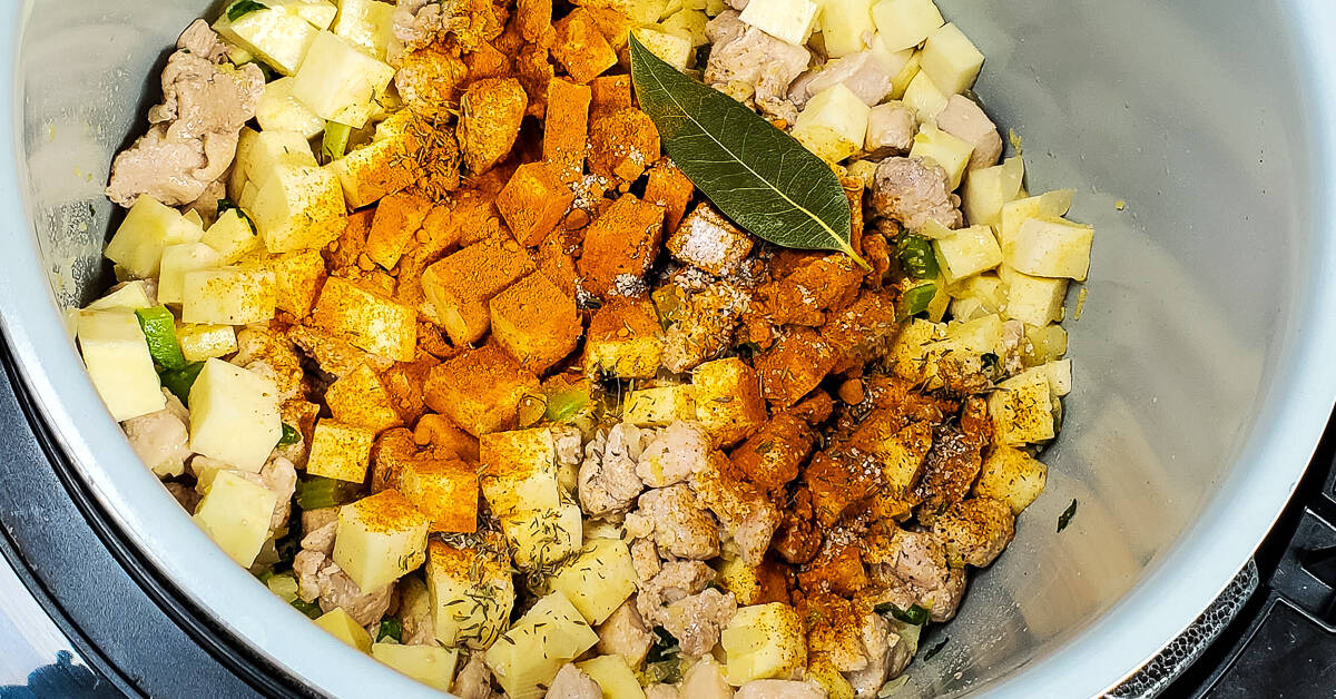 Turmeric Ginger Chicken Soup adding spices