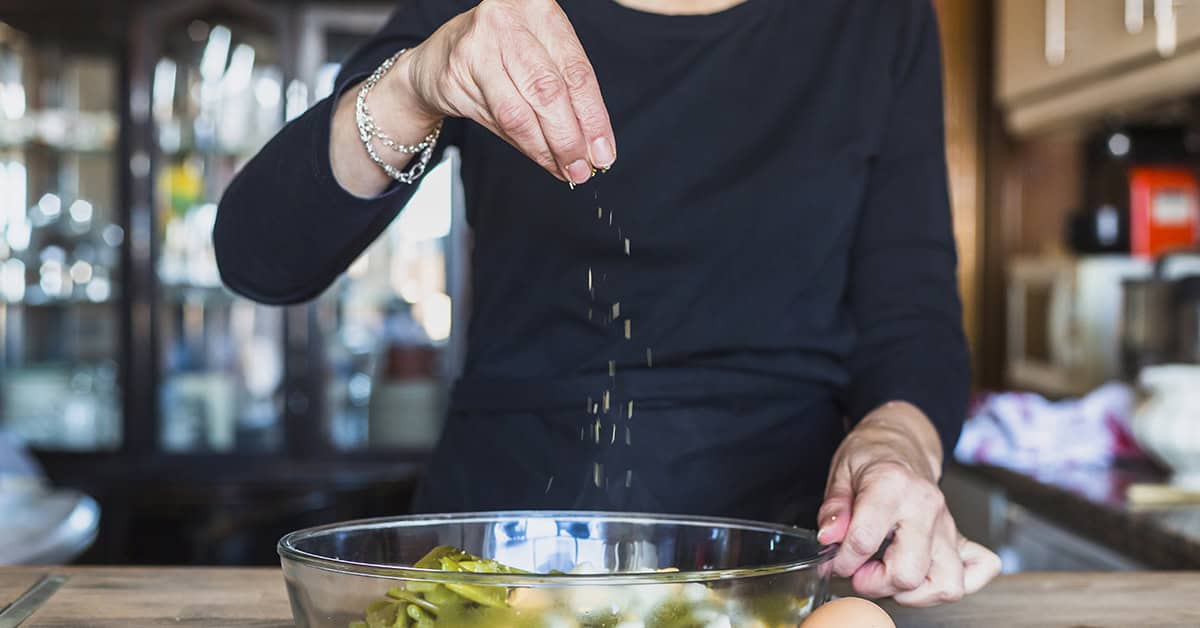 adding salt to dish