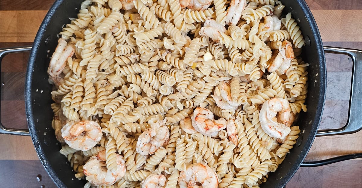 Middle Eastern Flavored Shrimp and Pasta stirring to incorporate butter and cheese