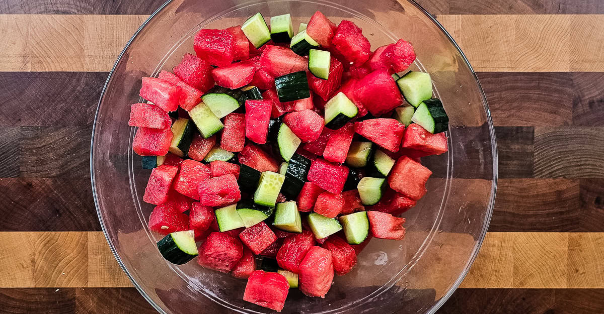 Watermelon and Cucumber Salad fruit added to the bowl