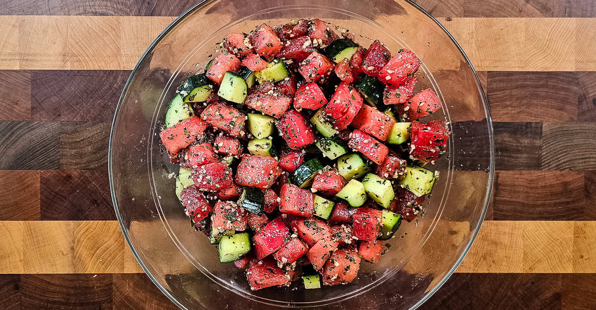 Watermelon and Cucumber Salad salad tossed to coat with the sauce