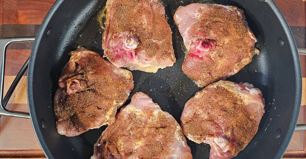 Indian Spiced Chicken Thighs With Coconut Rice chicken cooking skin side down