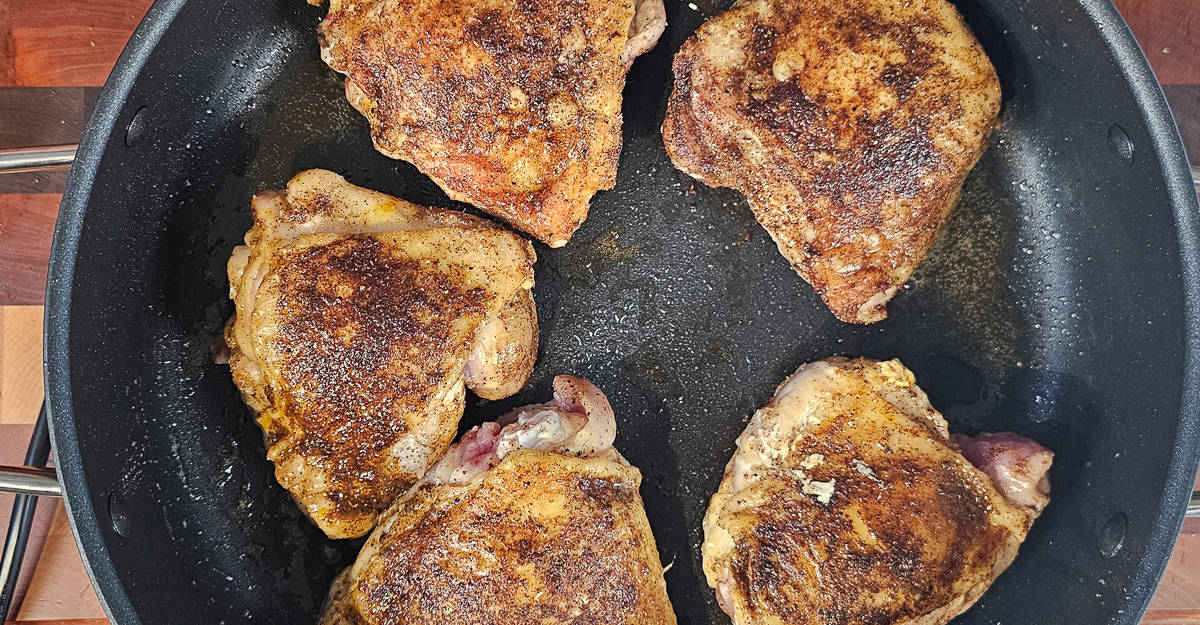 Indian Spiced Chicken Thighs With Coconut Rice chicken cooking skin side up