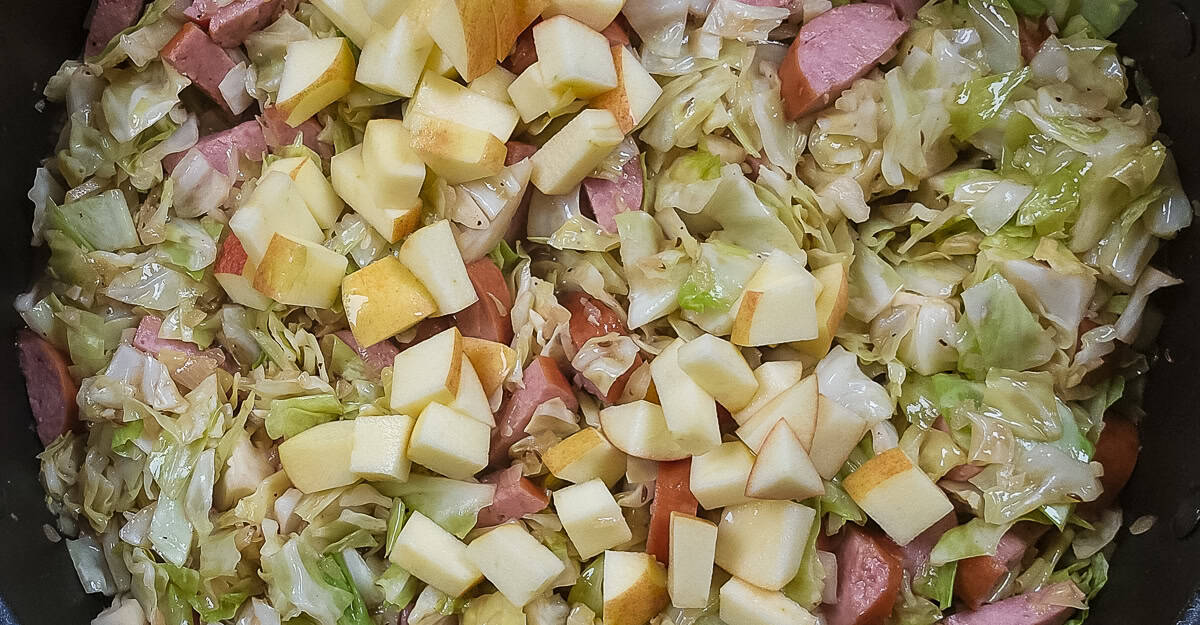 Kielbasa, Cabbage, and Apple Skillet Dinner apples added to the pan