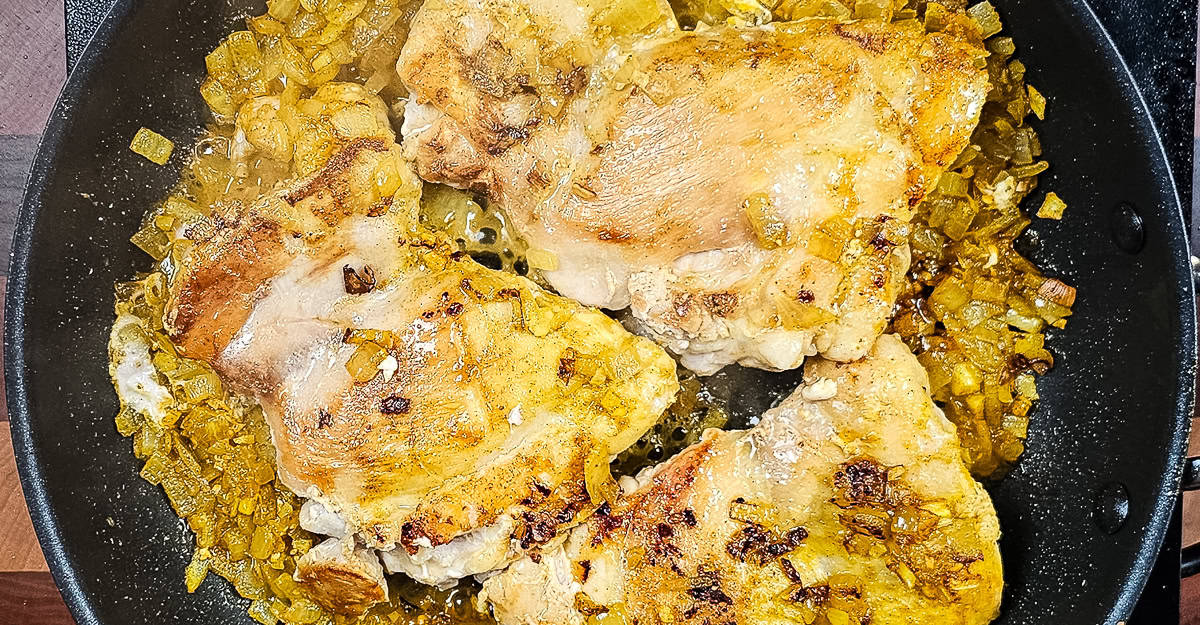 One Pot Chicken and Turmeric Rice chicken flipped to cook other side