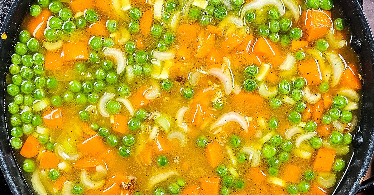 One Pot Chicken and Turmeric Rice stock added to the pan